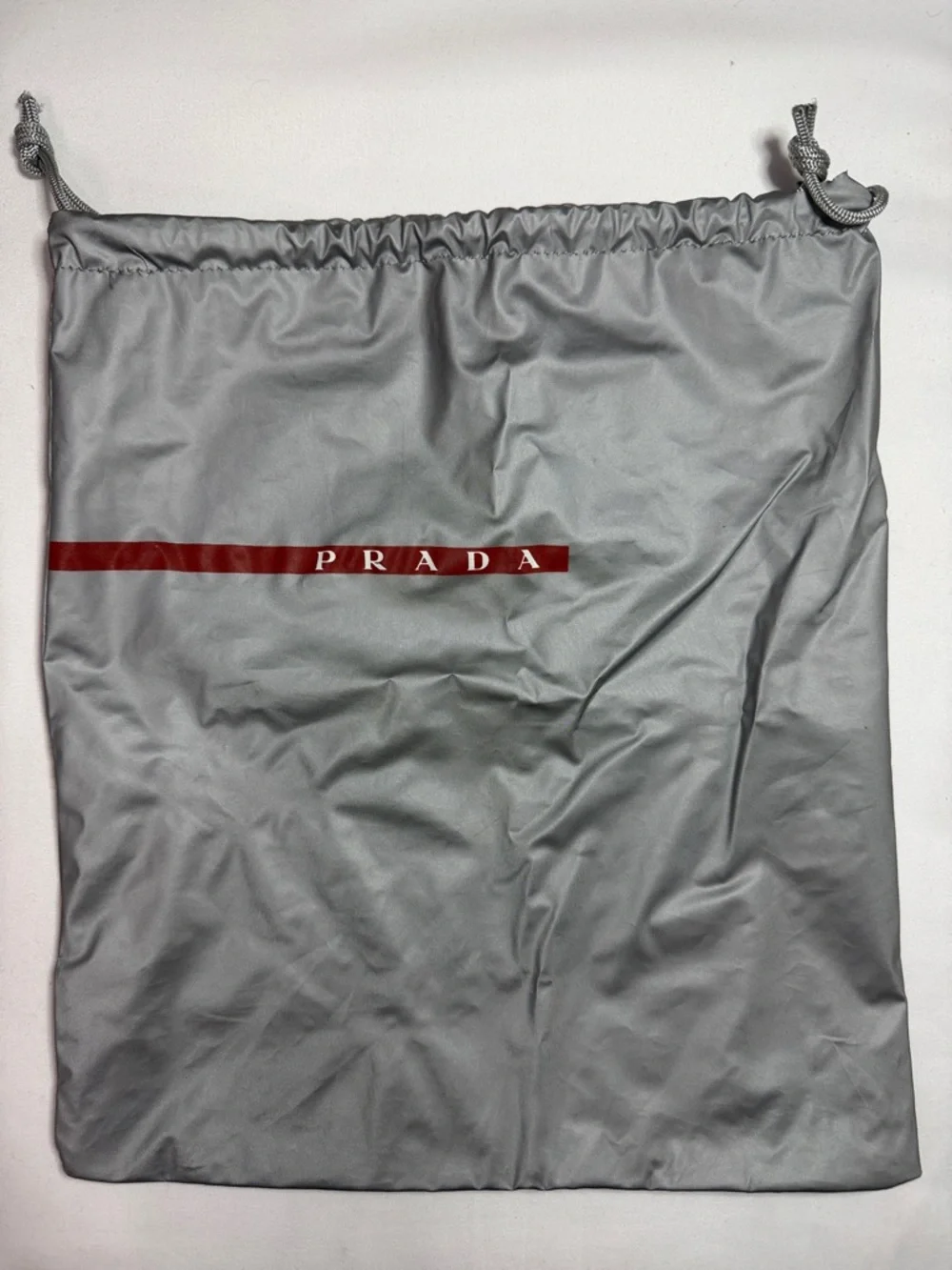 Prada Silver-Gray Drawstring Dust Bag with Red Logo Stripe